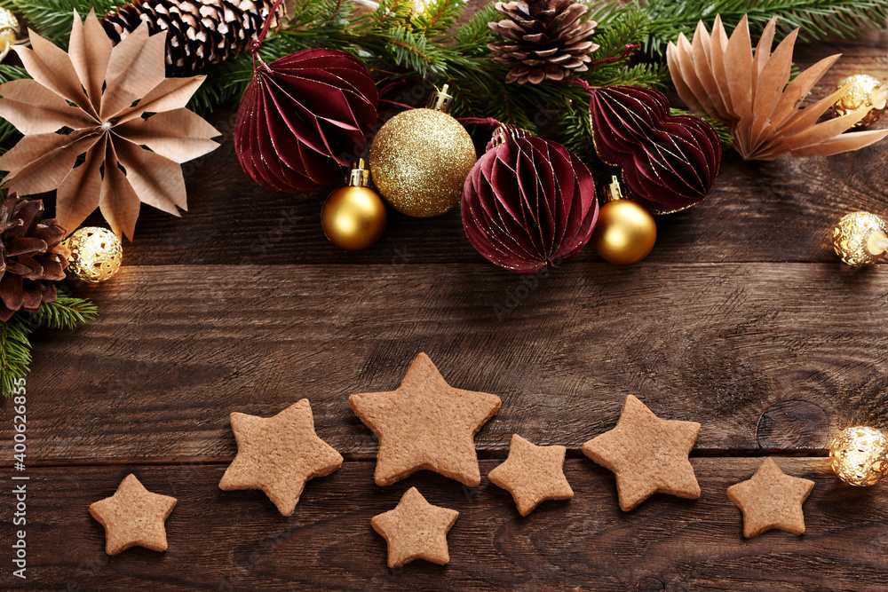 Christmas flat lay with gingerbread cookies and paper decors on wooden background Christmas flat lay with gingerbread cookies and paper decors on wooden background