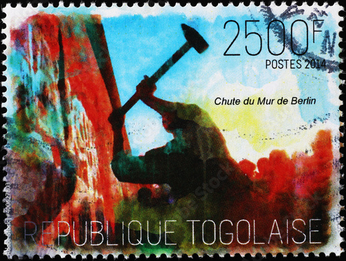 The fall of Berlin wall on stamp of Togo photo