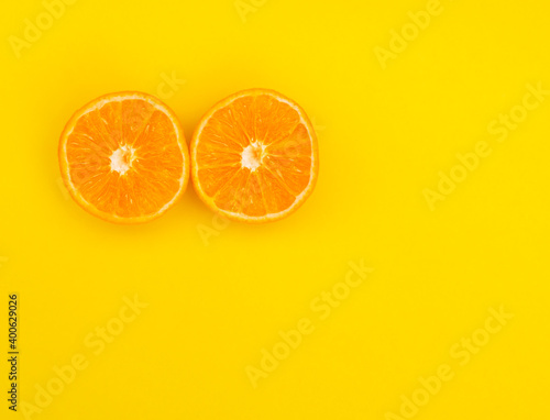 Oranges slices on a orange background