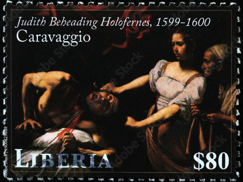 Judith beheading Holofernes by Caravaggio on postage stamp photo