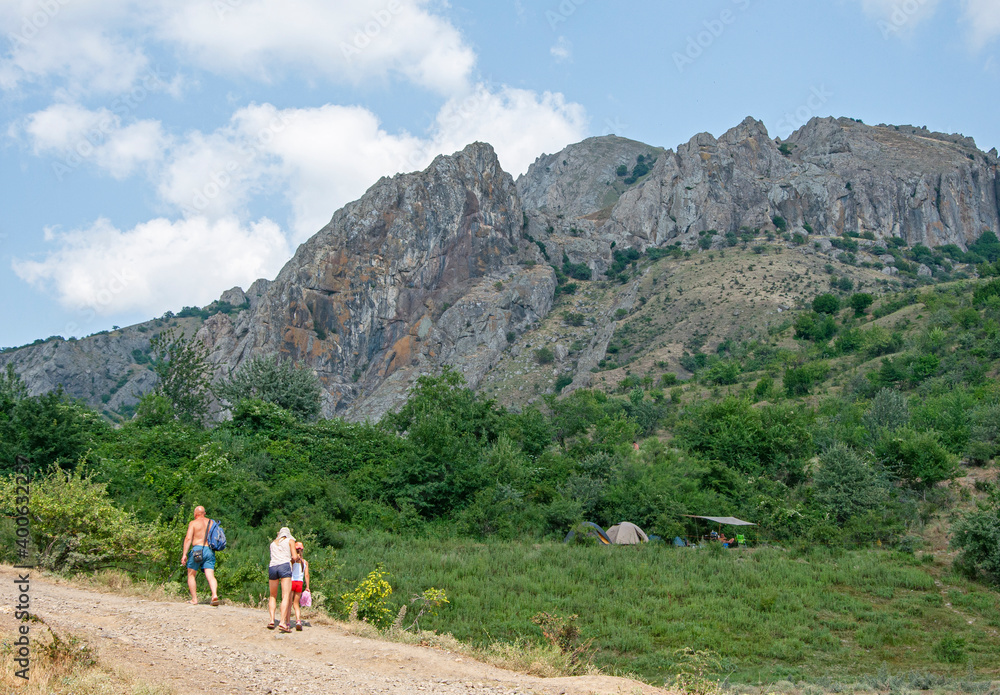 Tourists in the Crimean mountains on a summer day