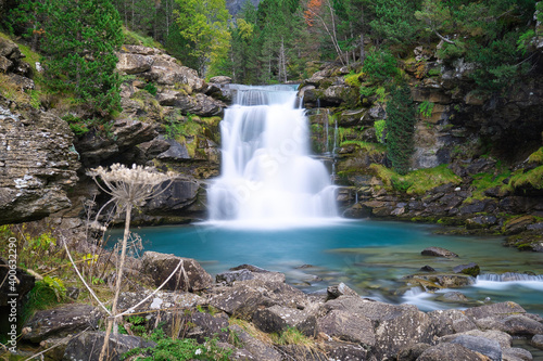 waterfall in river with turquoise water