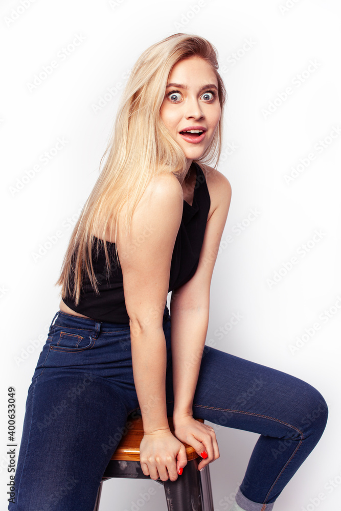 Fototapeta premium young blond woman on white backgroung gesture thumbs up, isolated emotional posing