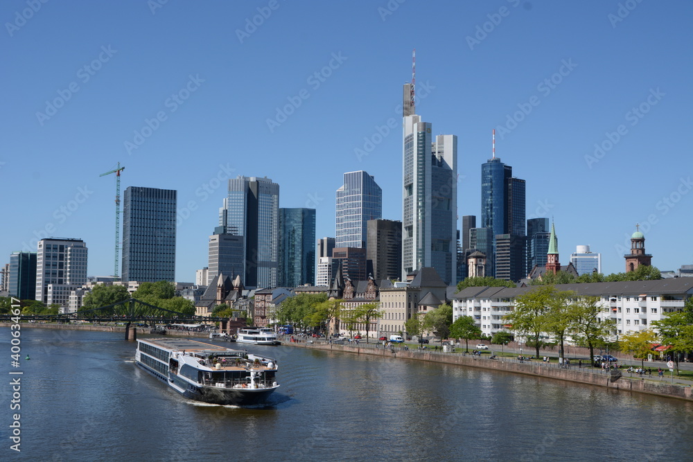 A boat on the river Main in the background the skyline of Frankfurt on Main, in Germany
