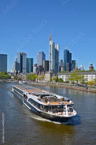 A boat on the river Main in the background the skyline of Frankfurt on Main  in Germany