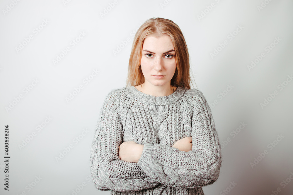 Offended angry woman standing with crossed arms Offended angry woman standing with crossed arms