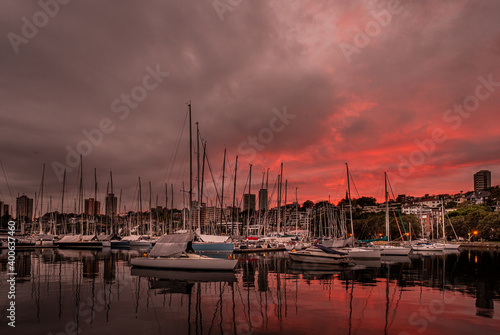 red dawn clouds and yachts