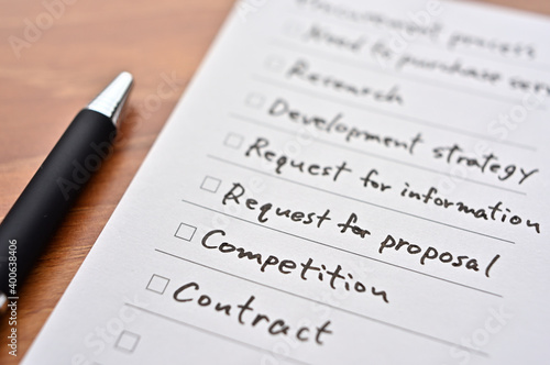 The checklist with "Procurement Process" written on it. It is focus on "Conpetition".