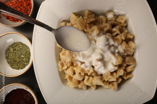 Turkish Manti manlama on plate photo