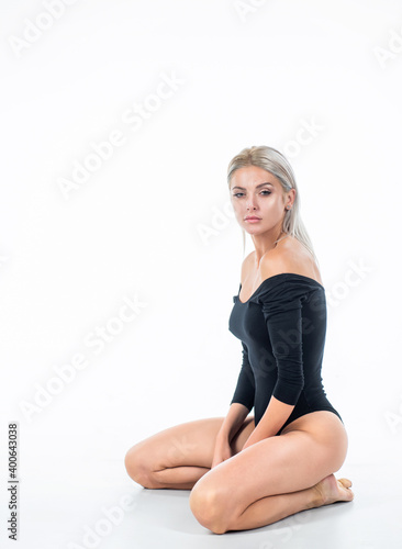 lady in body suit with sexy smooth leg skin isolated on white, beauty
