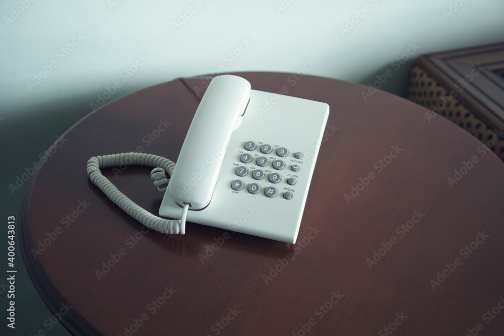 telephone on table in a hotel room telephone on table in a hotel room