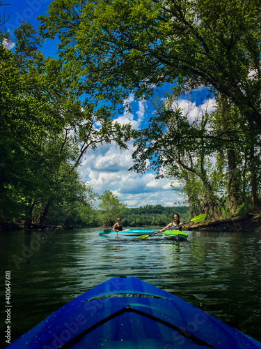 First Person Kayaker Kayaking Down River to Girls in Kayaks