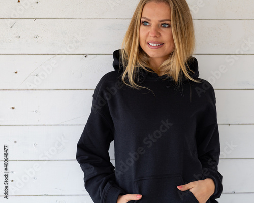 Sweatshirt model mockup, blonde wearing  black hoodie.
