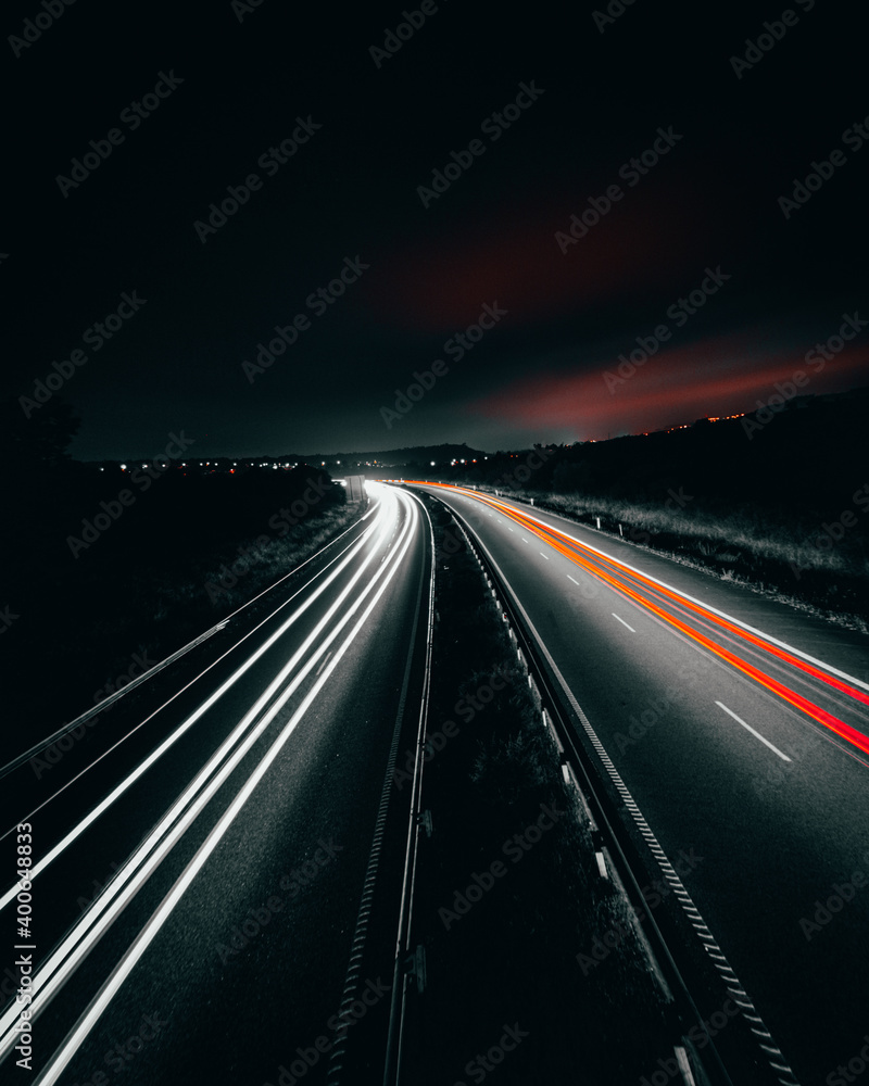 Long exposure on the highway during the night. Long exposure on the road. Long exposure on the highway during the night. Long exposure on the road.