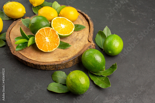 front view fresh sour lemons on dark background fruit citrus lime photo