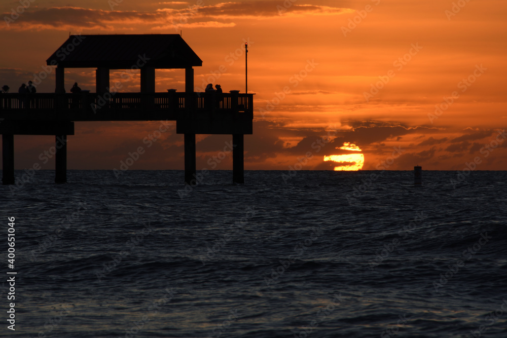 Silhouette of fishing pier on Clearwater beach with sunset on the horizon. Tampa, Florida, USA. Copy space. Silhouette of fishing pier on Clearwater beach with sunset on the horizon. Tampa, Florida, USA. Copy space.
