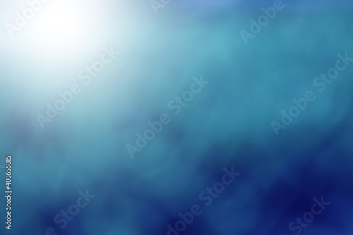 Blue light leaves blurred and blur natural abstract. Effect sunlight soft bright shiny style bokeh circle yellow and orange blurry morning . For wallpaper backdrop and background. 