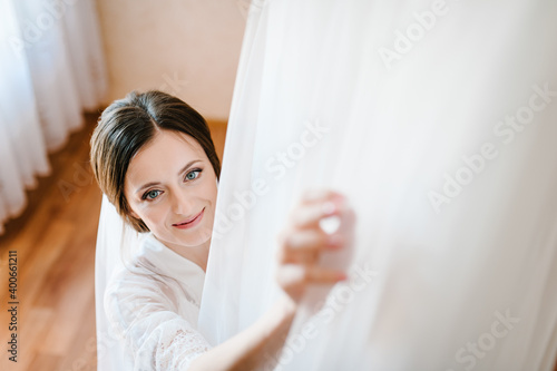 Bride touch on white wedding dress. Bride. Preparations.