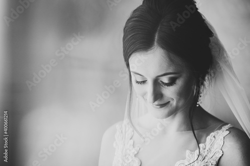 Perfect fashion model woman with beautiful hairstyle and make-up at home. Beautiful style bride. Black and white photo.