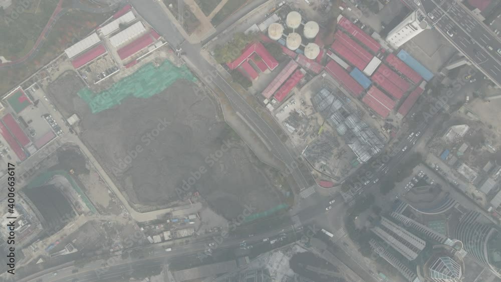 Construction site top view of mud and excavator machines on the ground, drone aerial view of the place in construction. Business, industrial and construction industry concept footage in Shanghai China Construction site top view of mud and excavator machines on the ground, drone aerial view of the place in construction. Business, industrial and construction industry concept footage in Shanghai China