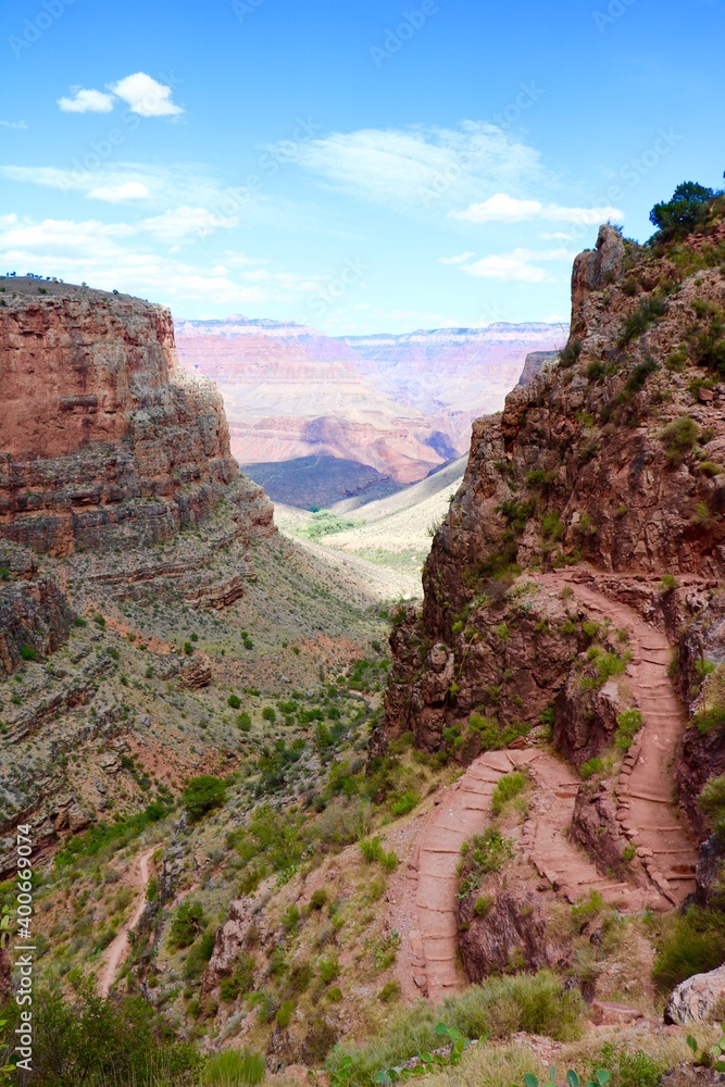 Grand Canyon path leading down into the red and green canyon