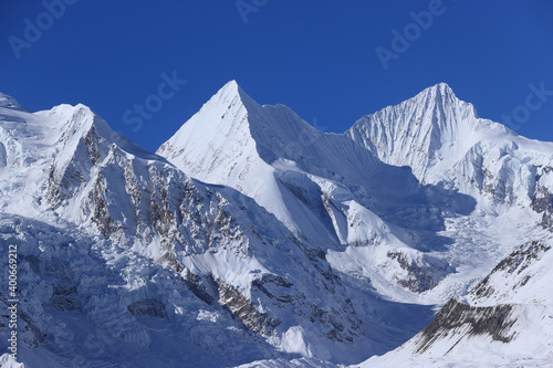Snow mountains and glaciers under blue sky in tibet China