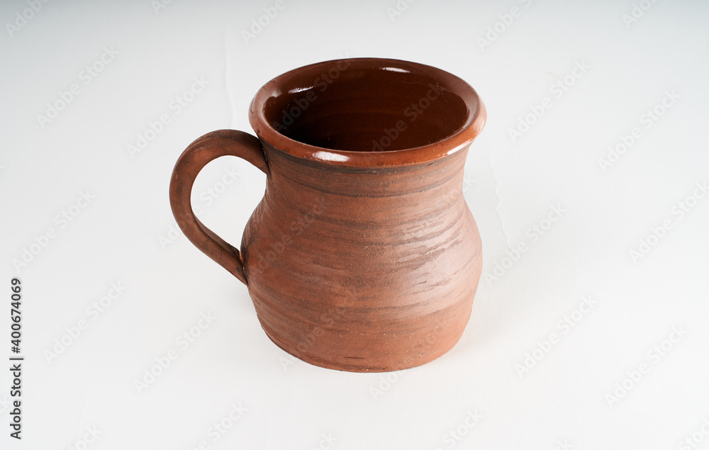 Pottery Craft, ceramic product with your own hands, made on a Potter's wheel, isolated on a white background. Pottery Craft, ceramic product with your own hands, made on a Potter's wheel, isolated on a white background.