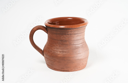 Pottery Craft  ceramic product with your own hands  made on a Potter s wheel  isolated on a white background.