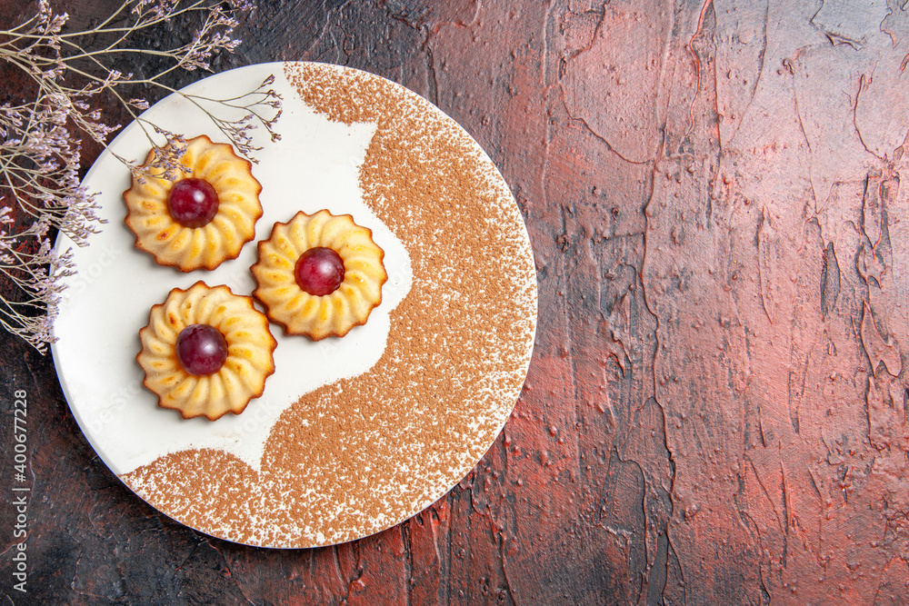 top view yummy little cookies inside plate on dark background cake sweet biscuit sugar top view yummy little cookies inside plate on dark background cake sweet biscuit sugar