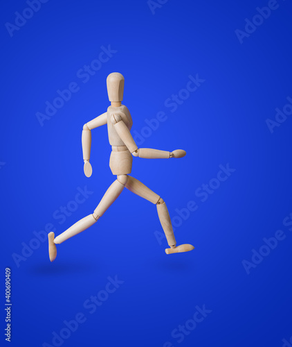 Sports wooden toy figure on blue