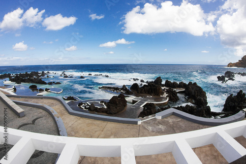 Madeira Lava Pools. Swimming in atlantic ocean background. Porto Moniz city on Madeira island in Portugal landscape. photo