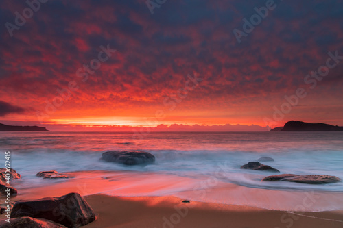 Fototapeta Naklejka Na Ścianę i Meble -  High Cloud Colours Up for Sunrise Solstice at the Seaside