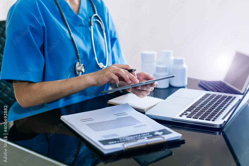 Medicine doctor hand working with modern digital tablet computer interface as medical network concept Medicine doctor hand working with modern digital tablet computer interface as medical network concept