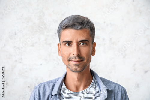 Man with graying hair on li...