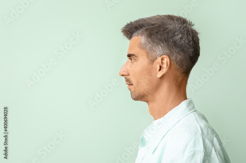 Man with graying hair on co...