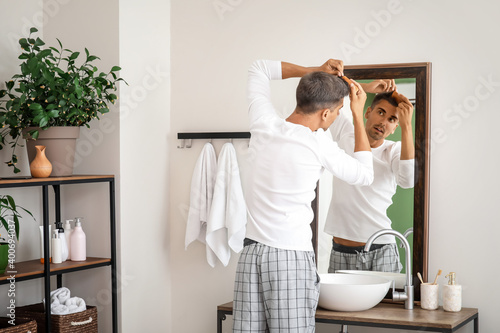 Stressed man with graying h...