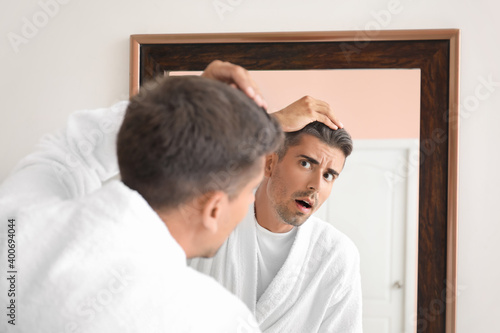 Stressed man with graying h...
