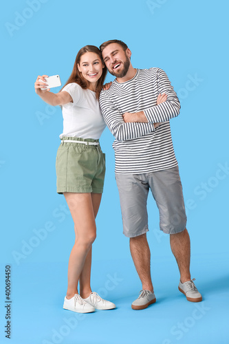 Young couple taking selfie ...