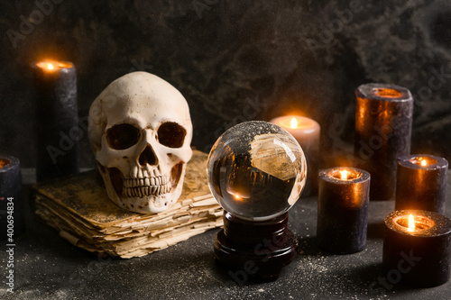 Accessories of fortune teller on table photo