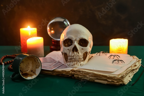 Accessories of fortune teller on table photo