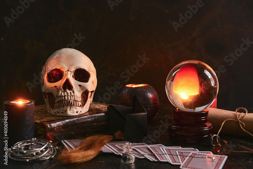 Accessories of fortune teller on table photo