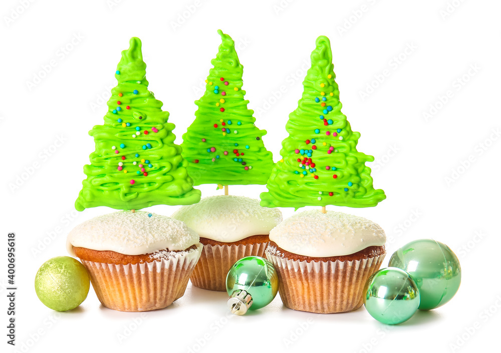 Tasty Christmas cupcakes on white background Tasty Christmas cupcakes on white background