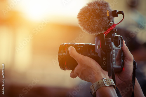 Blogger content creator camera handheld shooting video footage photo