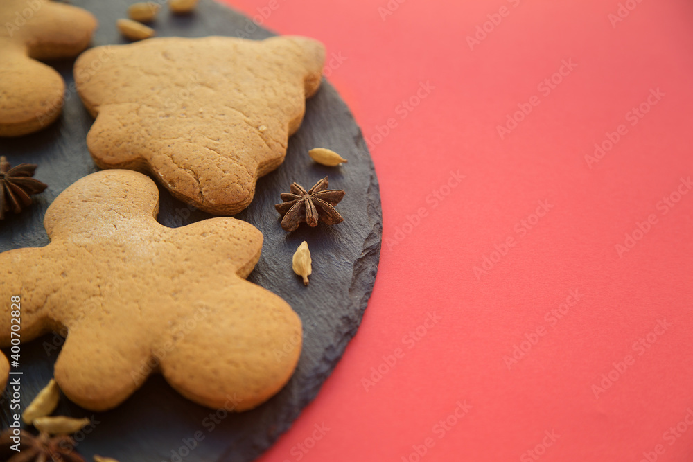 gingerbread in the form of ginger men on a red background, New Year and Christmas photo. gingerbread in the form of ginger men on a red background, New Year and Christmas photo.