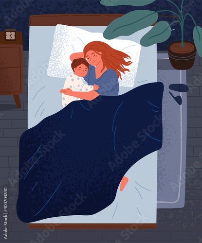 Happy mother hugging little child, sleeping together in bedroom Cute relaxed family lying on comfy bed under blanket at night. Mom and kid embracing each other and slumbering at home