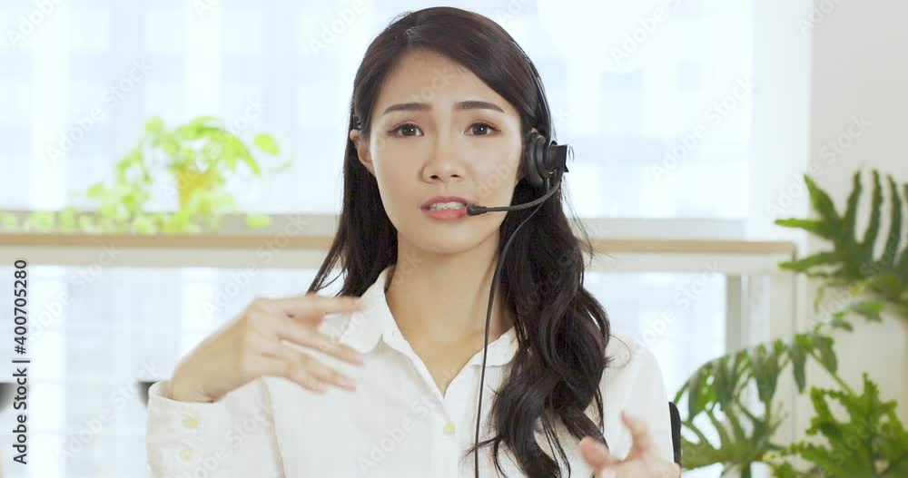 Business woman making video call, looking at camera and talking Business woman making video call, looking at camera and talking