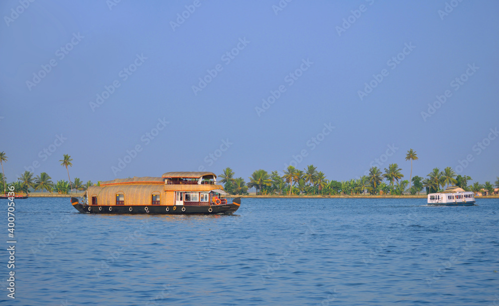 House boats in Kerala sailing on a lake	