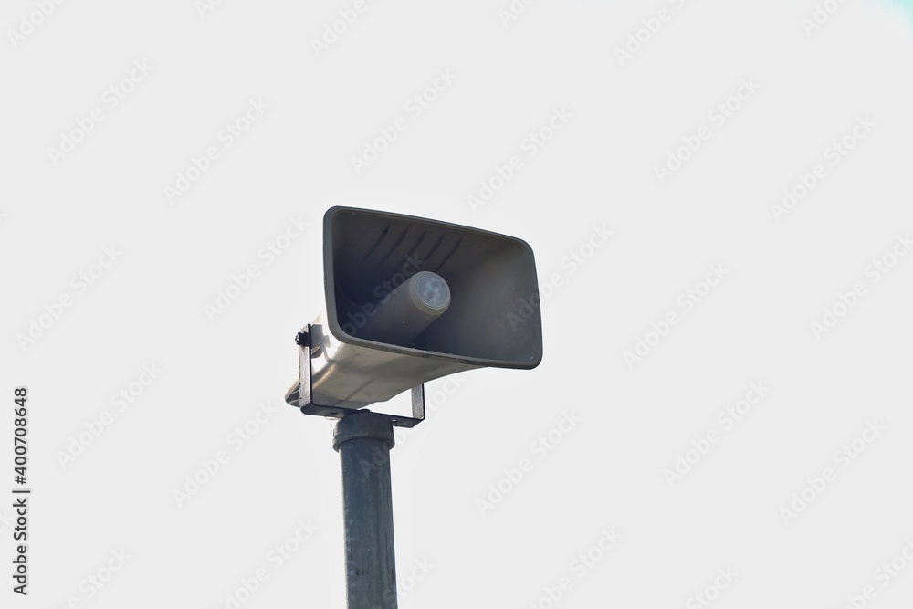 A loud speaker pole in public place on white isolated background with copy space A loud speaker pole in public place on white isolated background with copy space