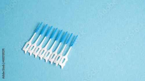 Home dental cleaning kit. Small brash for dental hygiene. Dental care. Teeth cleaning tool. Interdental brush on blue