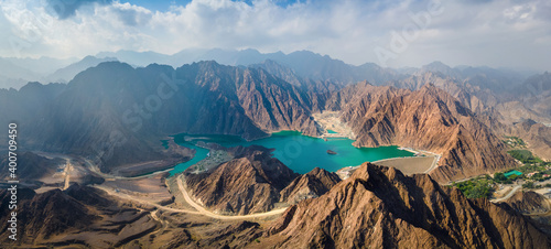 Hatta Dam Lake in eastern region of Dubai, United Arab Emirates aerial panorama photo